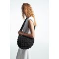 QUILTED MESSENGER